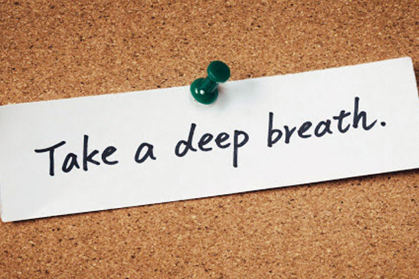 "Take a Deep Breath" Saying on Bulletin Board