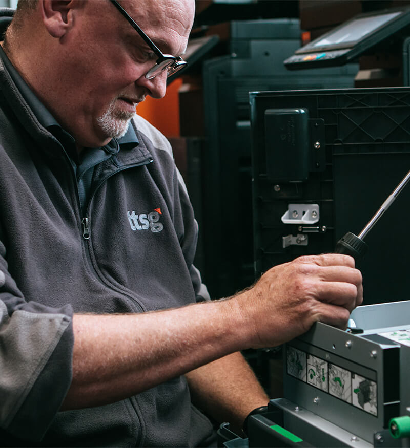 ttsg-john TTSG employee, John Withers servicing on a copier